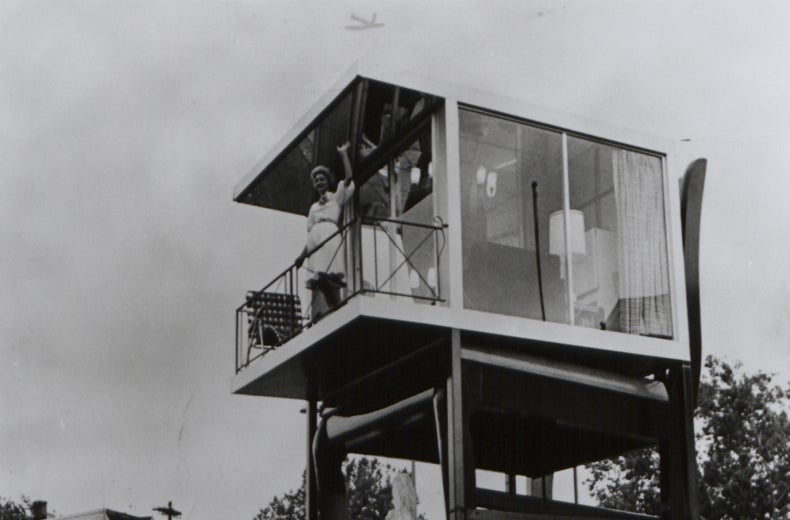 Lynn Arnold waves to onlookers from her glass apartment atop the Big Chair in Anacostia. (Reprinted with permission of the DC Public Library, Star Collection, © Washington Post.)