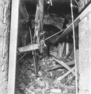 A pathway in the Capitol's basement in completely blocked by rubble and debris.