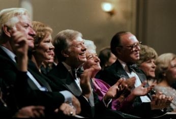 Jimmy Carter watches a performance at Fords Theater, with Rosalynn Carter and others.