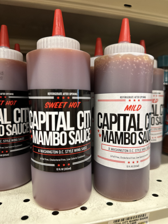 Capital City Mumbo Sauce bottles on grocery store shelf in DMV. (Credit: Mark Jones)