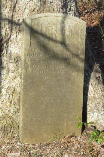 A photograph of John Townshend's grave with the following inscription: "Sacred to the memory of John Townshend who was born November 1, 1765 and died May 14, 1846 in the 81st year of his age. A man universally esteemed as a good citizen. Shrewd in his business transactions, in which as in everything else, he professed to be governed by his talking mind and personal interview with the Almighty."