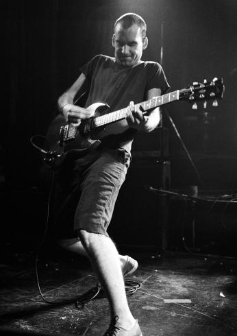 Ian MacKaye of Fugazi performing at the Kilburn National Ballroom in London, 1990. (Photo by Ian Dickson/Redferns)