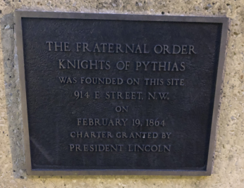 Photo of plaque with inscription reading "The Fraternal Order Knights of Pythias Was Founded on This Site. 914 E. Street, N.W. on February 19, 1864. Charter Granted by President Lincoln"