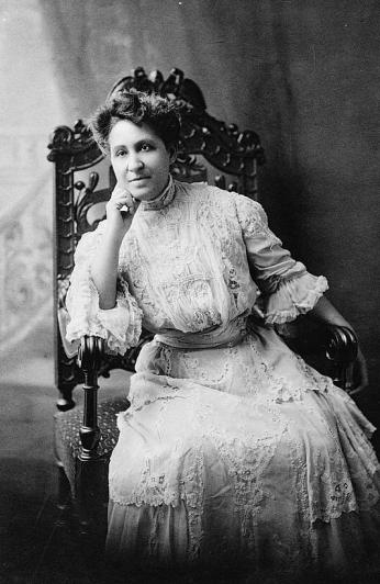 Educator-Activist Mary Church Terrell seated facing the camera in white, victorian attire.