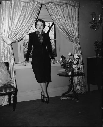 Cissy Patterson standing with her back to a window c. 1939. (Source: Library of Congress)