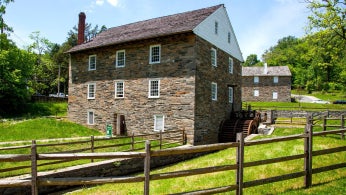 A modern photo of the exterior of the Peirce Mill, a three story brick building