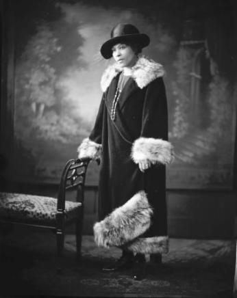 Portrait of a woman in a fur-trimmed coat (Source: Scurlock Collection/The Smithsonian)