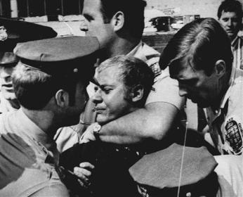Arthur Bremer is restrained by police after he shot Gov. George Wallace in Laurel, Maryland on May 15, 1972. (Photo source: Associated Press)