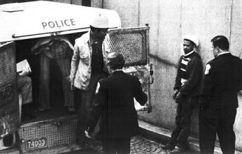 Some of the Hanafi Muslims who held hostages at gunpoint, at three locations in Washington, arrive at Superior Court, in Washington, on March 11, 1977, for arraignment. (AP Photo)