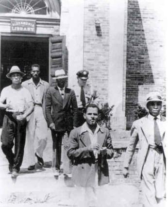 Police removing sit-in participants from the Alexandria Library (Source: Wiikpedia) Police removing sit-in participants from the Alexandria Library (Source: Wiikpedia)