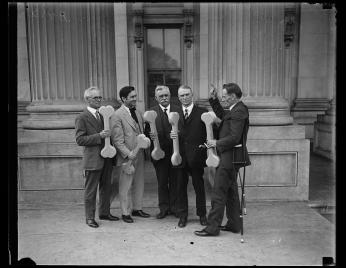 Group of men holding bones, probably connected to "Bone dry" support of prohibition; William D. Upshaw, proponent of temperance movement, at right. U.S. Capitol, Washington, D.C. Group of men holding bones in support of Prohibition