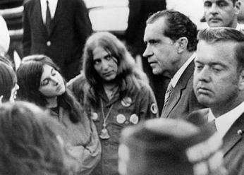 In the early morning hours of May 9, 1970 President Nixon drove to the Lincoln Memorial and mingled with a group of anti-war demonstrators. Here, Nixon chats with Barbara Hirsch, 24, of Cleveland, Ohio (left) and Lauree Moss, of Detroit, Mich. (Photo: © Bettmann/CORBIS)