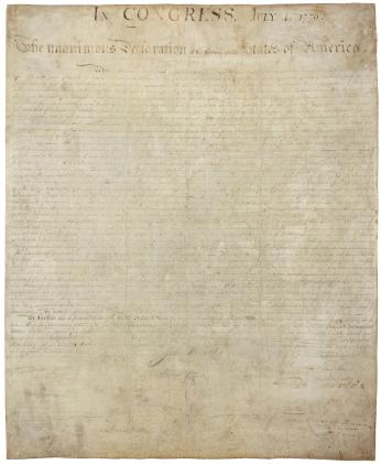 A high-resolution scan of the Declaration of Independence, showing the extremely faded ink and mysterious handprint on the bottom left corner (Source: National Archives)