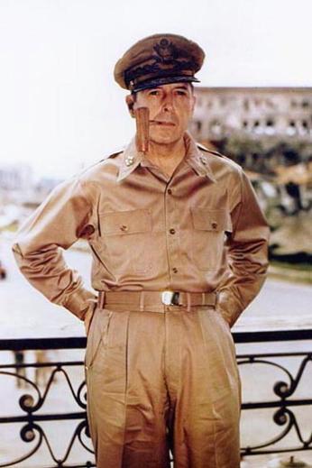 Douglas MacArthur, smoking his signature corncob pipe
