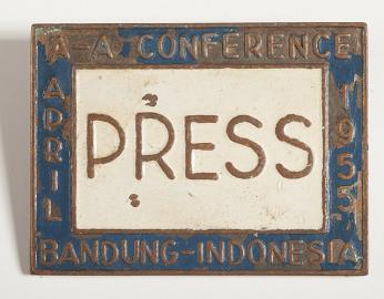 A copy of Ethel Payne's press pass for the Bandung Asian-African Conference. The pin is labeled "Press" and the conference title rings the label. 