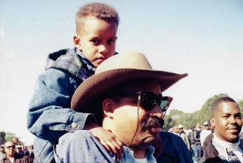 Father with son on his shoulders at the Million Man March, 1995 Father with son on his shoulders at the Million Man March, 1995