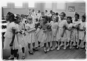 Young children stand in line in an integrated classroom at Barnard School in May 1955