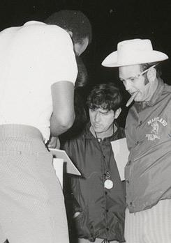 Coach "Lefty" Driesell puffed on a cigar while his players huffed and puffed around the track at midnight on October 15, 1971. (Photo source: NCAA.com)