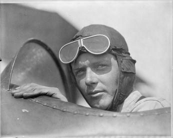 Charles Lindbergh, wearing helmet with goggles up, in open cockpit of airplane at Lambert Field, St. Louis, Missouri, 1923. (Source: Library of Congress)