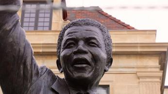 Statue of Nelson Mandela outside South African embassy in Washington, D.C. (Photo by flickr user taedc used via Creative Commons)