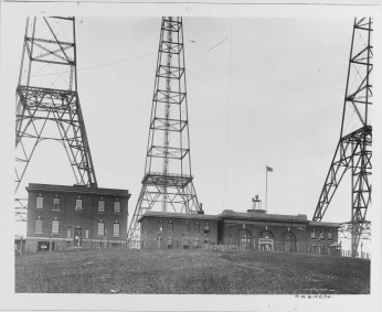 Image of the ground level buildings at Arlington Radio Station, surrounded by the radio towers.