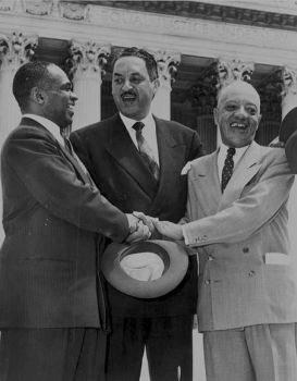 George E.C. Hayes, Thurgood Marshall, and James Nabrit Jr congratulate each other outside of the Supreme Court on the day of the decision
