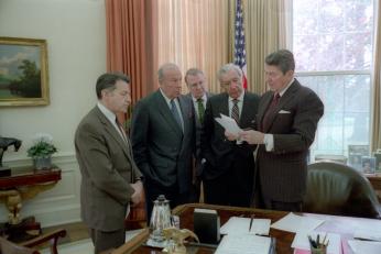 President Reagan meets with advisors in the Oval Office to discuss Iran Contra