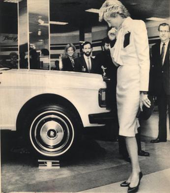 Princess Diana ponders a Rolls Royce sedan balancing on Wedgwood teacups on display at the J.C. Penney department store in Springfield, Va., Nov. 11, 1985. Their Royal Highnesses walked through the closed store in the Washington suburb. (AP Photo/Bob Daugherty) 1985