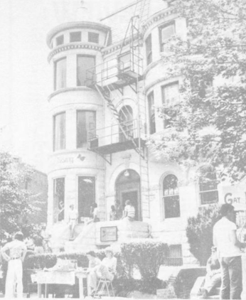 Exterior of Lambda Rising Bookstore with a booth in front of it for Gay Pride day, 1975 Exterior of Lambda Rising Bookstore with a booth in front of it for Gay Pride day, 1975