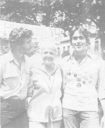 An older woman at Gay Pride Day 1975 standing with two young men An older woman at Gay Pride Day 1975 standing with two young men