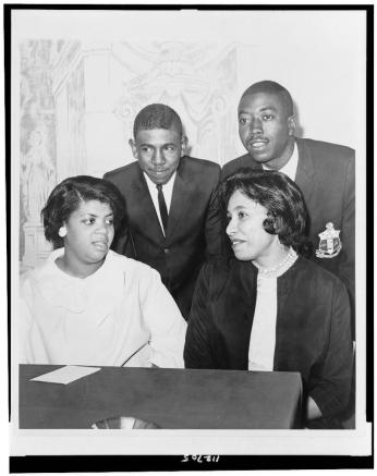 Spottswood Bolling poses with three of the other lead plaintiffs in other state desegregation cases, circa 1964