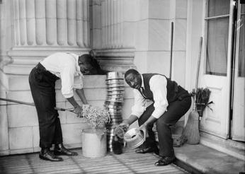 U.S. Capitol custodians cleaning spittoons in 1914. (Source: Harris &amp; Ewing Collection at the Library of Congress)