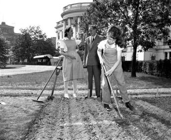 Diana Hopkins hoes her victory garden at the White House as her parents look on. (Source: AP)