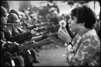 Jan Rose Kasmire, confronts National Guard troops during Vietnam War protest outside Pentagon on October 21, 1967 (Photo by Marc Riboud, licensed from Magnum Photos)