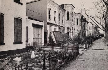 Row of rundown homes on 7th St SW