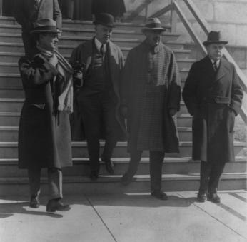 Ned McLean leaves the Capitol Building with his lawyers