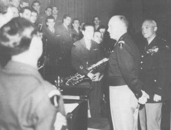 Army Air Forces Band personnel are congratulated by Gen. Eisenhower and Gen. Arnold at the National Press Club, Washington, DC, November 13, 1945 (Photo Source: dennismspragg.com) https://www.dennismspragg.com/inside-glenn-miller-declassified/homeward-bound/