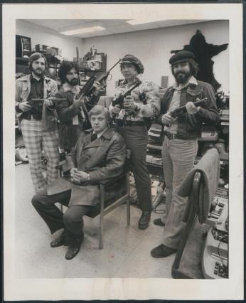 Lt. Robert Arscott and the Operation Sting team sit amid stolen goods