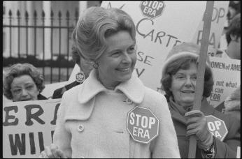 Phyllis Schlafly, wearing a "STOP ERA" badge, protesting the Equal Rights Amendment in front of the White House in February 1977