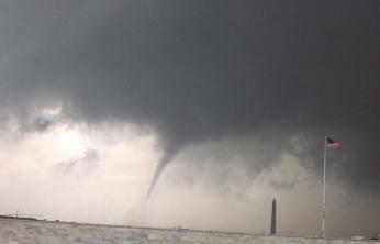 The most recent Washington tornado, on September 24, 2001. British invaders and Washingtonians might have seen a similar sight bearing down on them on that August day in 1814, although the Washington Monument hadn't been built yet, the U.S. flag had far less than 50 stars, and the storm might not even have been a tornado (see right), so maybe not. (Image source: National Weather Service