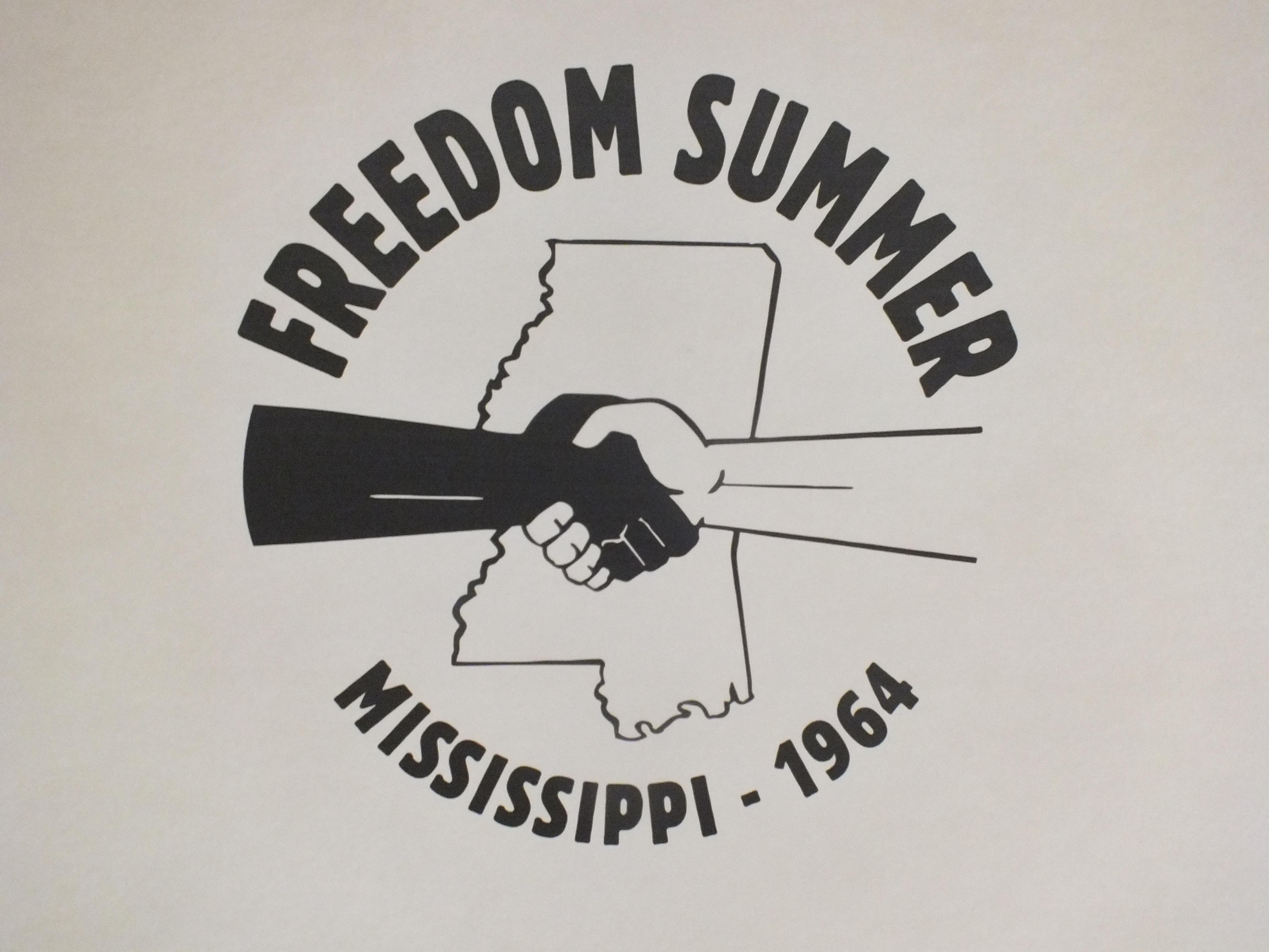 "Freedom Summer Mississippi 1964" poster depicting black hand shaking white hand over state map of Mississippi. (Source: Flickr user Princeton Public Library. Cropped and used via Creative Commons Attribution-Non-commercial license, CC BY-NC 2.0.)