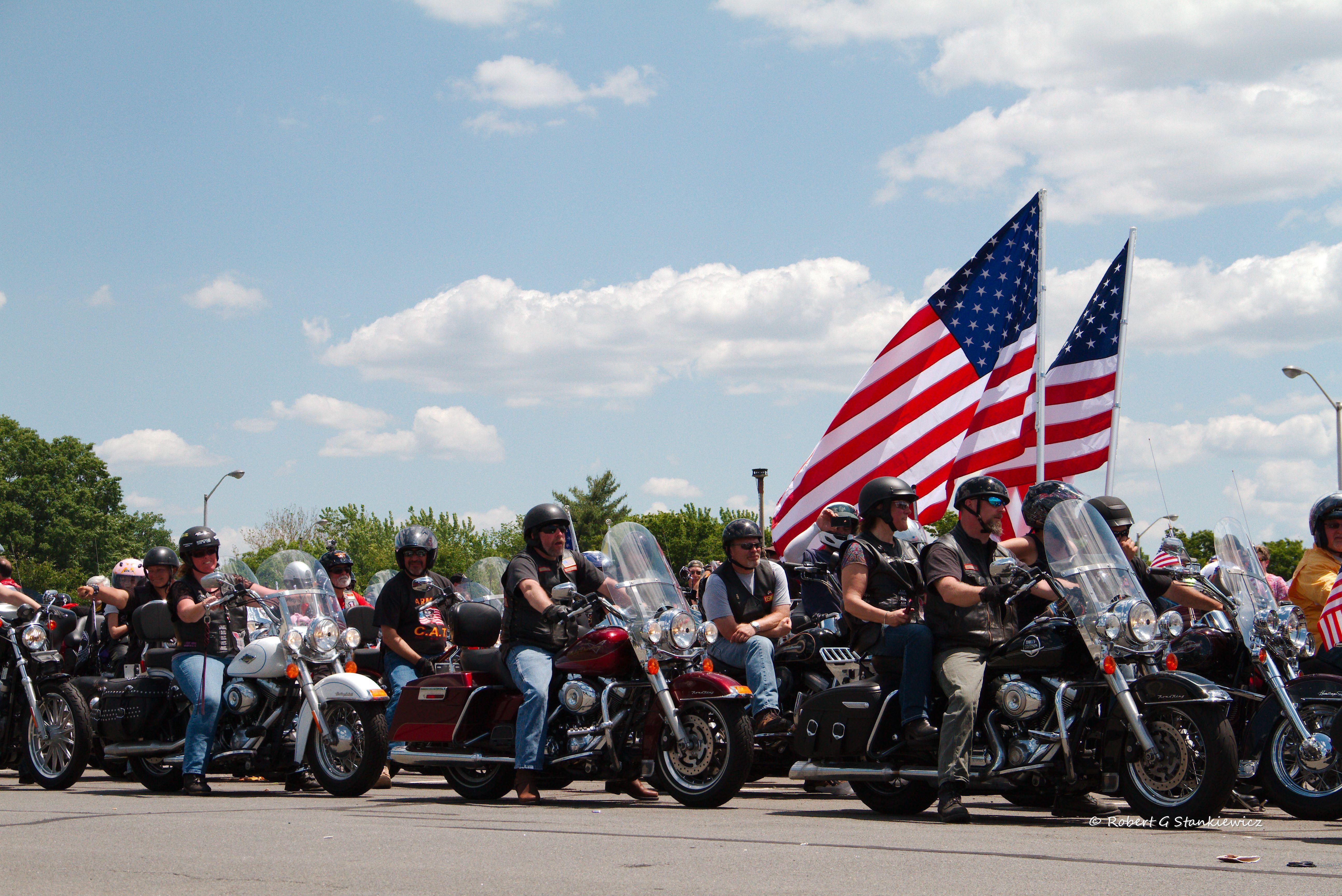 Rolling Thunder participants on their motorcycles with American flags in 2014. (Photo credit: Flickr user Robert Stankiewicz. Used via CC BY-SA 2.0 license.)