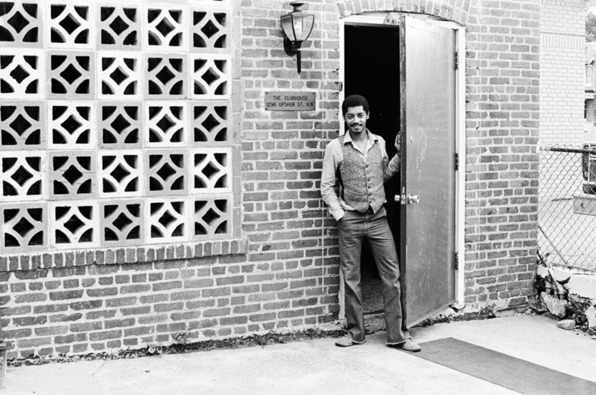 An unidentified man stands in front of the door of The ClubHouse.