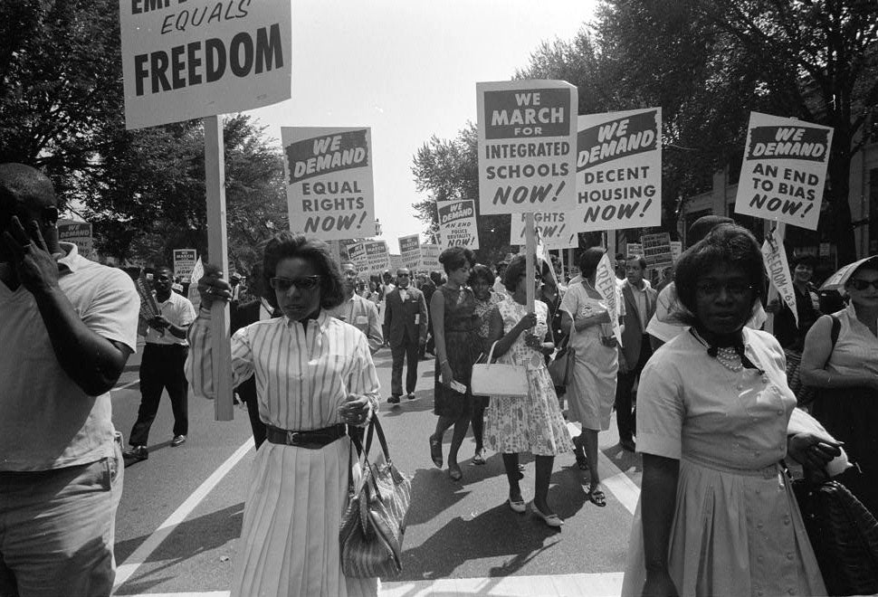 Protestors carrying signs for equal rights, integrated schools, decent housing, and an end to bias at the March on Washington for Jobs and Freedom, August 28, 1963. (Library of Congress)