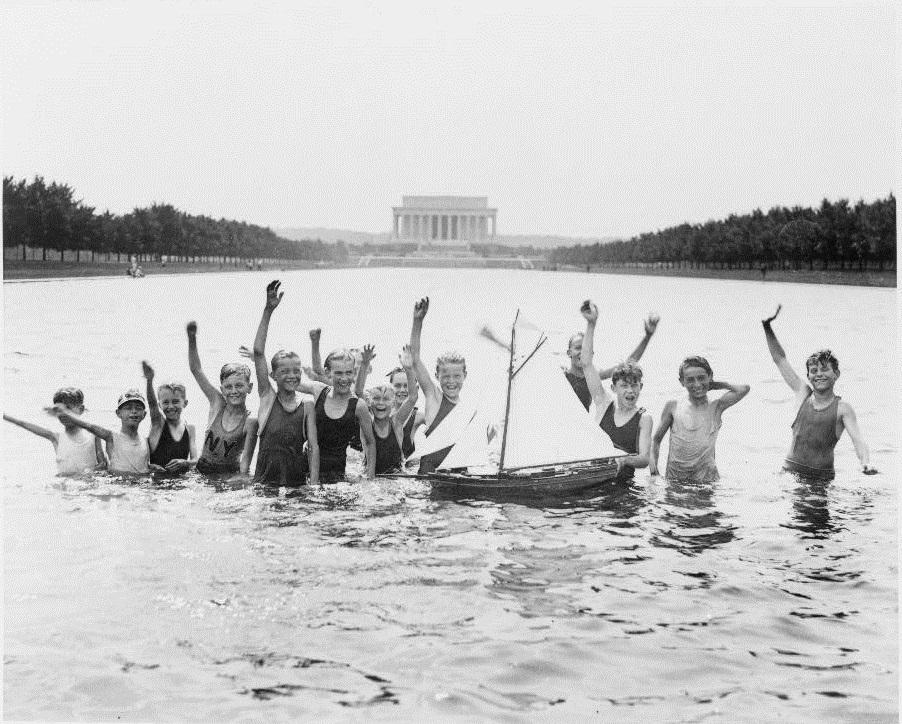 With a lack of public pools, young boys take a dip in the Reflecting Pool in 1926. 