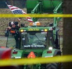 North Carolina tobacco farmer Dwight Watson single-handedly gridlocked downtown Washington in March 2003 when he drove his tractor into the pond at Constitution Gardens and claimed to have a bomb. (Photo source: Associated Press via Wikipedia)